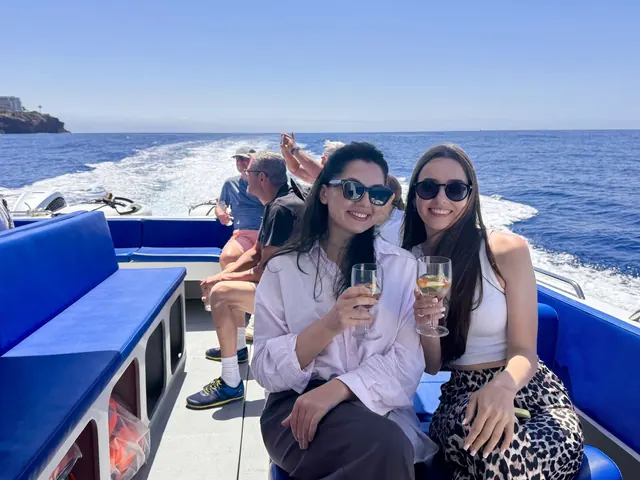 Guests on a shared catamaran cruise along Madeira's south coast